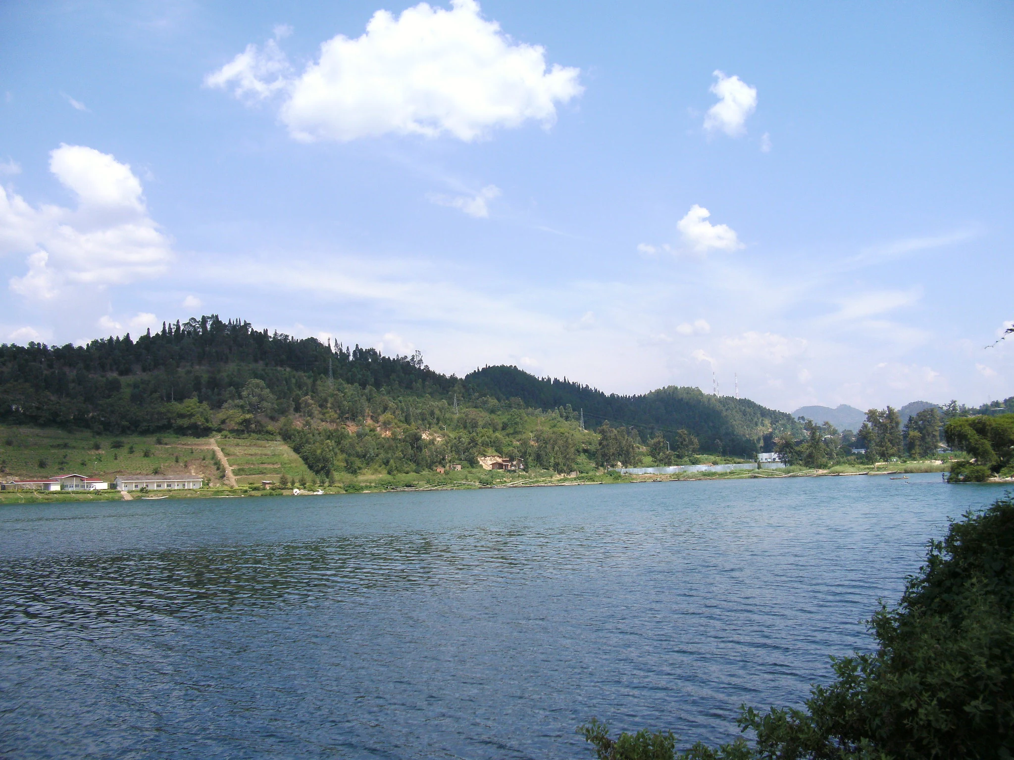 Panoramic view of Lake Kivu framed by rolling hills
